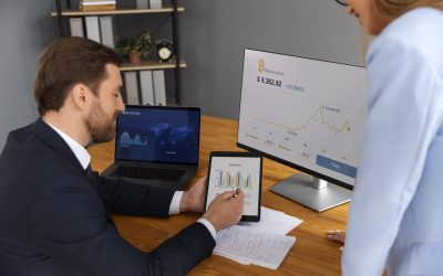 person-looking-finance-graphs-min